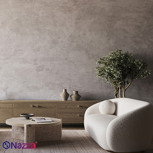 Interior moderno con pared de microcemento decorativo, acabado continuo y tono gris suave, que aporta un estilo elegante, actual y minimalista al espacio.